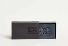 Load image into Gallery viewer, Bloke Soaps Hand On peppermint (Charcoal) soap in black cardboard packaging.
